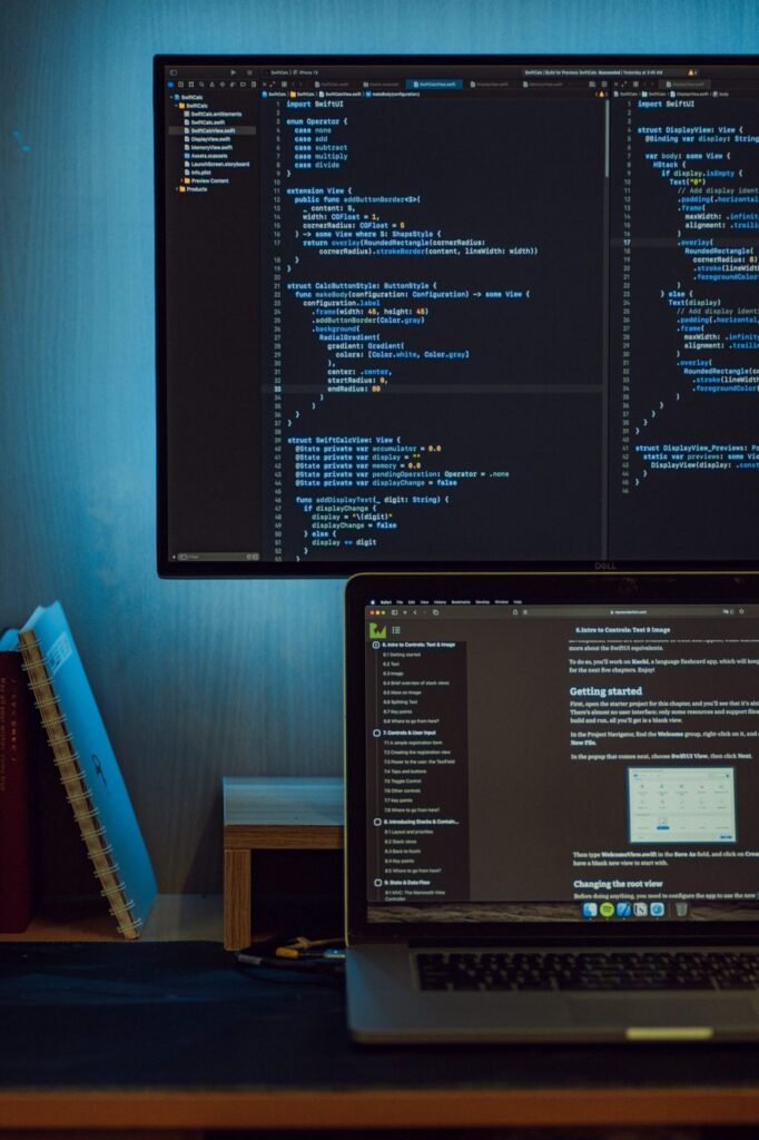 Computer screens displaying website code and technical configuration