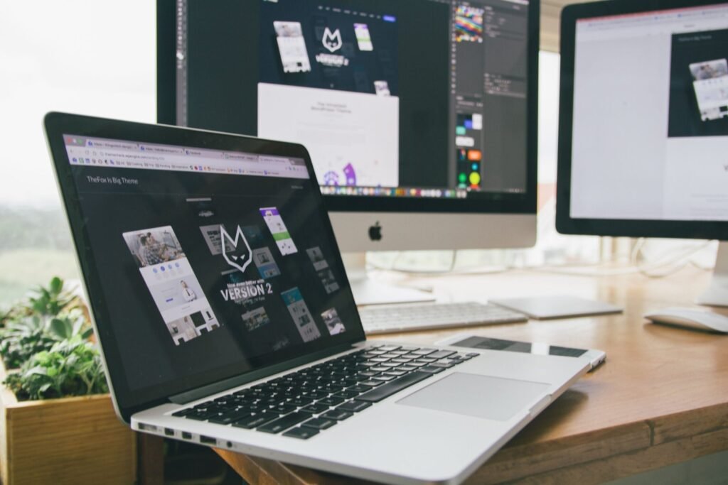 Web design and development workstation with laptop and monitor